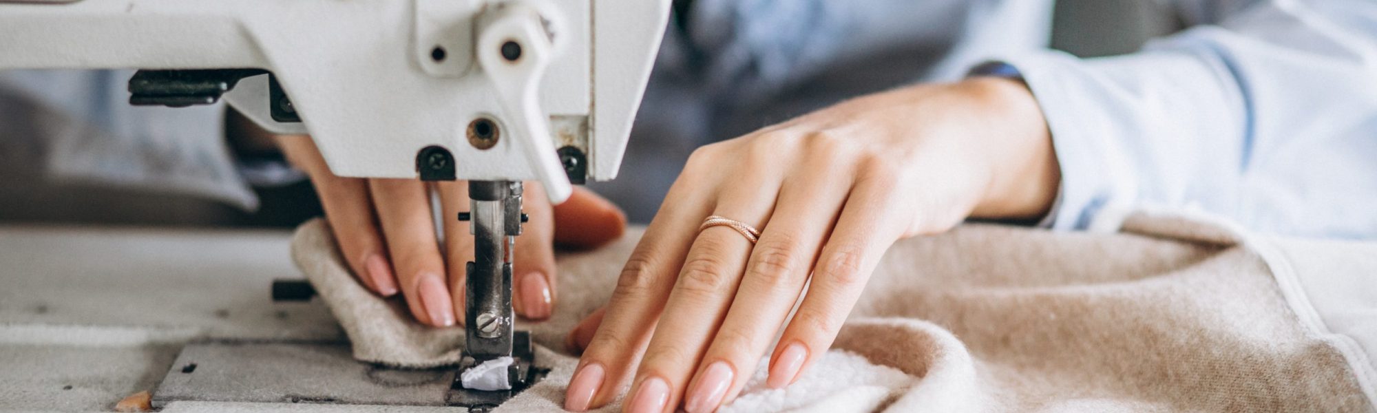 Woman tailor working at the sewing factory